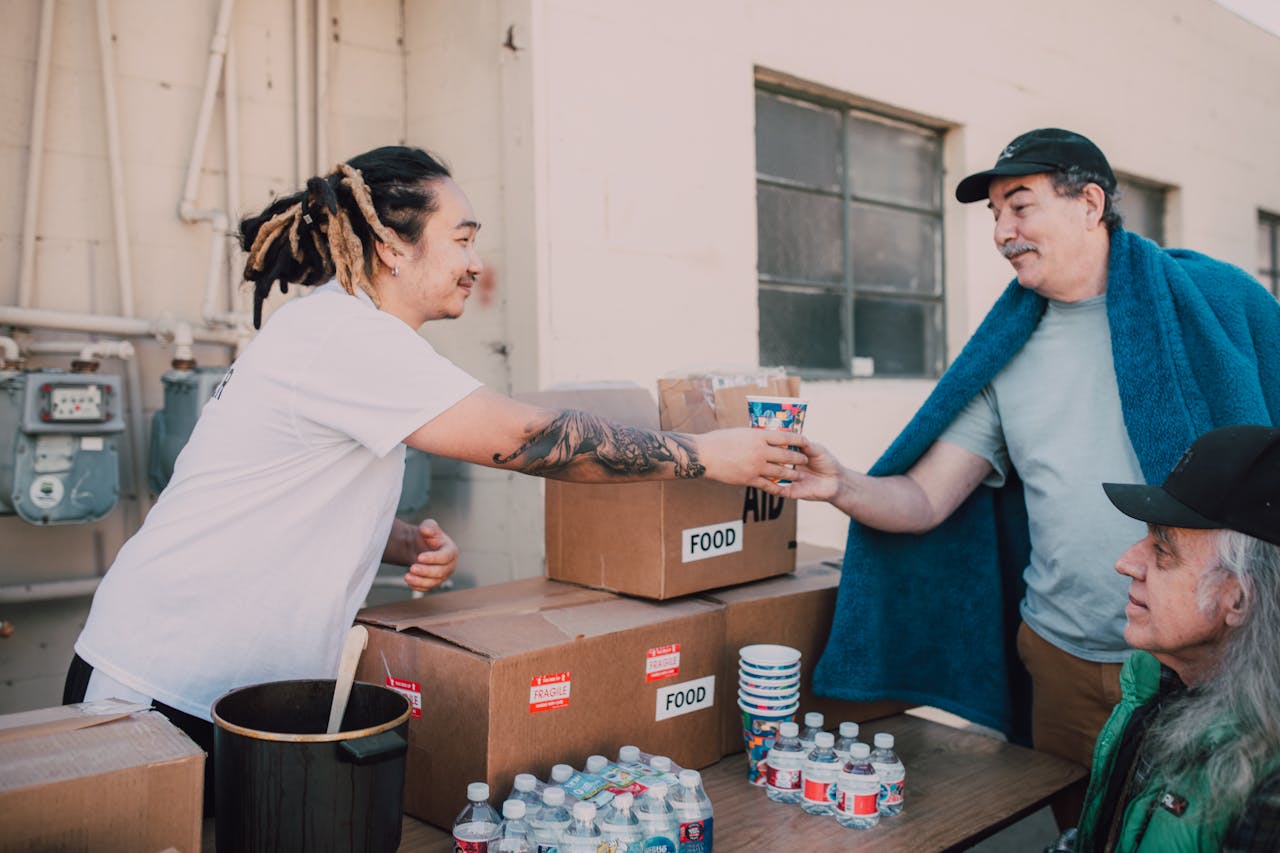 about-us Volunteers distribute food and aid packages to those in need, fostering community support.